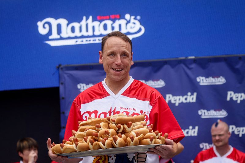 © Reuters. FILE PHOTO: World Champion Joey Chestnut during the weigh-in ceremony ahead of  2023 Nathan's Famous Fourth of July International Hot Dog Eating Contest in Coney Island Brooklyn in New York City, U.S., July 3, 2023.   REUTERS/Brendan McDermid/File Photo