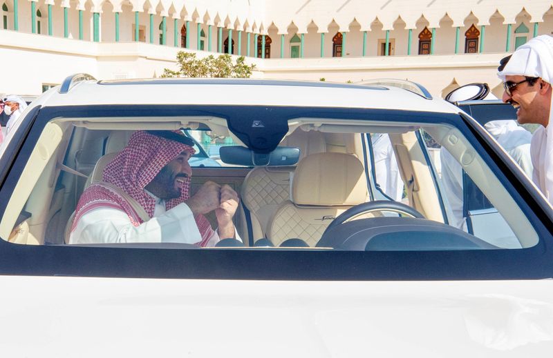 &copy; Reuters. Saudi Crown Prince Mohammed Bin Salman talks to the Emir of Qatar, Sheikh Tamim bin Hamad Al Thani, during his visit to Doha, Qatar, December 9, 2021 Bandar Algaloud/Courtesy of Saudi Royal Court/Handout via REUTERS/File Photo