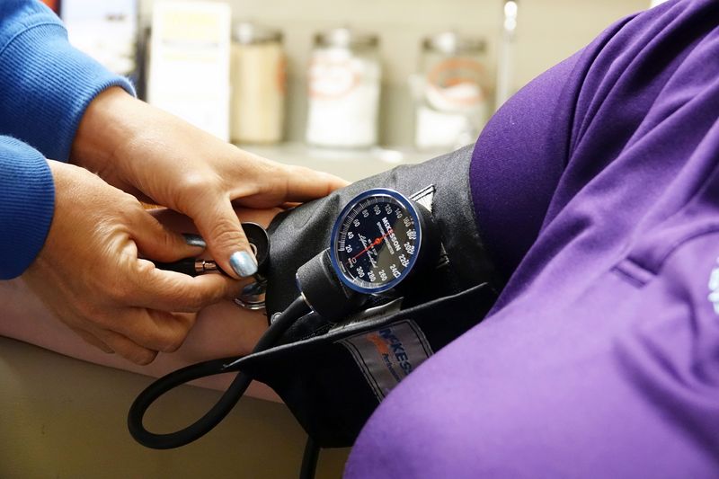 © Reuters. FILE PHOTO: A nurse takes someones blood pressure inside the East Arkansas Family Health Center in Lepanto, Arkansas, U.S., May 2, 2018. REUTERS/Karen Pulfer Focht/File Photo