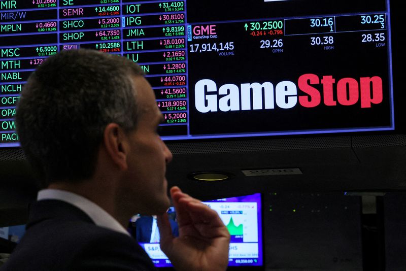 &copy; Reuters. FILE PHOTO: Traders work at the post where GameStop is traded on the floor at the New York Stock Exchange (NYSE) in New York City, U.S., June 12, 2024.  REUTERS/Brendan McDermid/File Photo