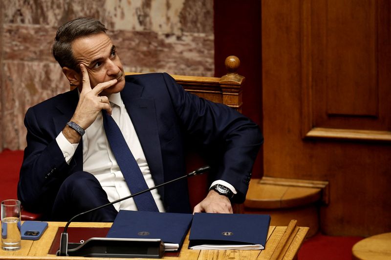 &copy; Reuters. FILE PHOTO: Greek Prime Minister Kyriakos Mitsotakis gestures as leader of PASOK party Nikos Androulakis addresses lawmakers at the parliament ahead of a vote on confidence following a censure motion submitted by leftist and centre-left opposition parties