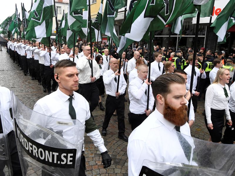 &copy; Reuters. FILE PHOTO: Members of the Neo-nazi Nordic Resistance Movement march through the town of Ludvika, Sweden May 1, 2018. The march was opposed by anti-fascist groups and the local police, reinforced from other parts of Sweden, kept the groups apart.  Ulf Pal