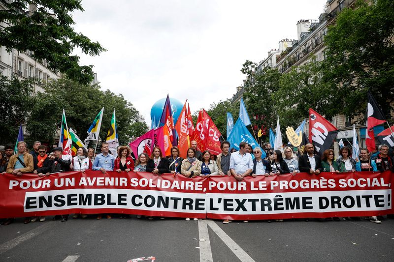 © Reuters. People attend a demonstration against the French far-right National Rally (Rassemblement National - RN) party, ahead of early legislative elections in Paris, France, June 15, 2024. REUTERS/Benoit Tessier