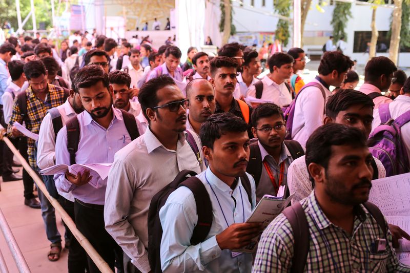 &copy; Reuters. FILE PHOTO: Job seekers line up for interviews at a job fair in Chinchwad, India, February 7, 2019. REUTERS/Danish Siddiqui/File Photo