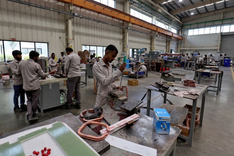 &copy; Reuters. FILE PHOTO: Employees assemble an electric transformer inside a manufacturing unit of Inductotherm  (India)  Private Limited at Sanand GIDC (Gujarat Industrial Development Corporation), on the outskirts of Ahmedabad, India, March 28, 2024. REUTERS/Amit Da