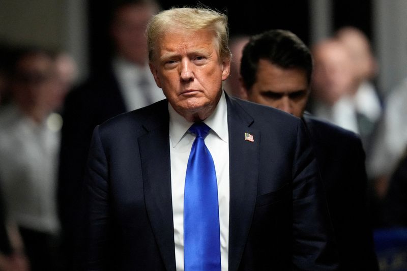 &copy; Reuters. FILE PHOTO: Former President Donald Trump walks to make comments to members of the media after being found guilty on 34 felony counts of falsifying business records in the first degree at Manhattan Criminal Court, Thursday, May 30, 2024, in New York.  Set