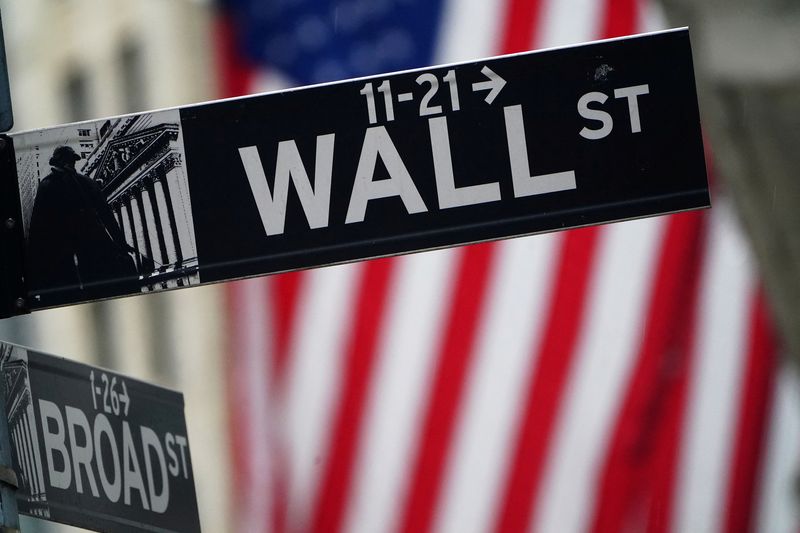 &copy; Reuters. FILE PHOTO: A Wall Street sign is pictured outside the New York Stock Exchange in the Manhattan borough of New York City, New York, U.S., October 2, 2020. REUTERS/Carlo Allegri/File Photo