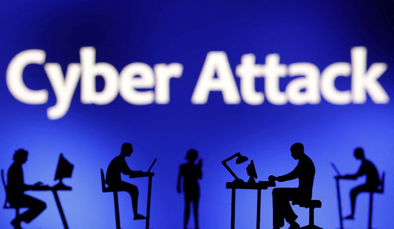 &copy; Reuters. FILE PHOTO: Figurines with computers and smartphones are seen in front of the words "Cyber Attack" in this illustration taken, February 19, 2024. REUTERS/Dado Ruvic/Illustration/File Photo