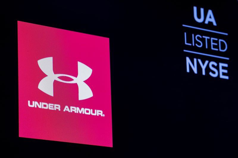 &copy; Reuters. FILE PHOTO: The ticker symbol and company logo for Under Armour, Inc. is displayed on a screen on the floor of the New York Stock Exchange (NYSE) in New York, U.S., January 22, 2019. REUTERS/Brendan McDermid/File Photo 
