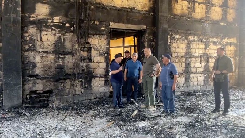 © Reuters. Sergei Melikov, the head of the Dagestan region, visits Derbent synagogue following an attack by gunmen and a fire, in Derbent in the region of Dagestan, Russia June 24, 2024, in this still image taken from video. Head of the Dagestan region Sergei Melikov via Telegram/Handout via REUTERS