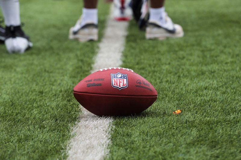 &copy; Reuters. FILE PHOTO: A ball with the National Football League (NFL) logo is spotted on a lush green field during a drill exercise at the talent identification camp for the NFL, in Lagos, Nigeria, June 17, 2024. REUTERS/Akintunde Akinleye/File Photo