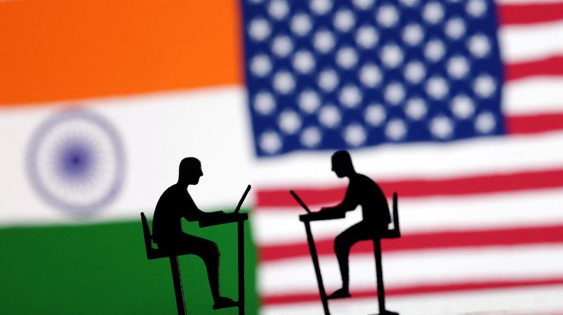 © Reuters. FILE PHOTO: The Indian flag, the U.S. flag and people miniatures with laptops are seen in this illustration taken March 10, 2024. REUTERS/Dado Ruvic/Illustration/File Photo