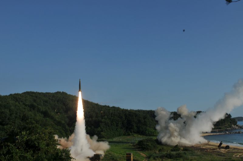 © Reuters. United States and South Korean troops utilizing the Army Tactical Missile System (ATACMS) and South Korea's Hyunmoo Missile II, fire missiles into the waters of the East Sea, off South Korea, July 5, 2017.   8th United States Army/Handout via REUTERS/File Photo