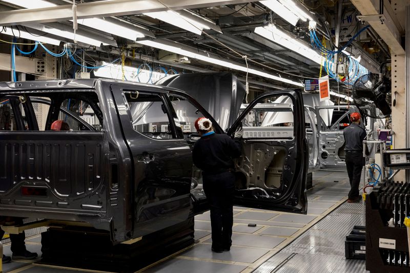 &copy; Reuters. FILE PHOTO: Workers assemble parts of Tundra trucks and Sequoia SUV's on the production line at Toyota's truck plant in San Antonio, Texas, U.S. April 17, 2023.  REUTERS/Jordan Vonderhaar/File Photo