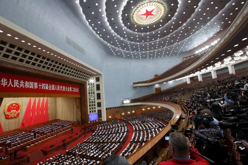 © Reuters. FILE PHOTO: Chinese officials and delegates attend the closing session of the National People's Congress (NPC) at the Great Hall of the People in Beijing, China March 11, 2024. REUTERS/Florence Lo/File Photo