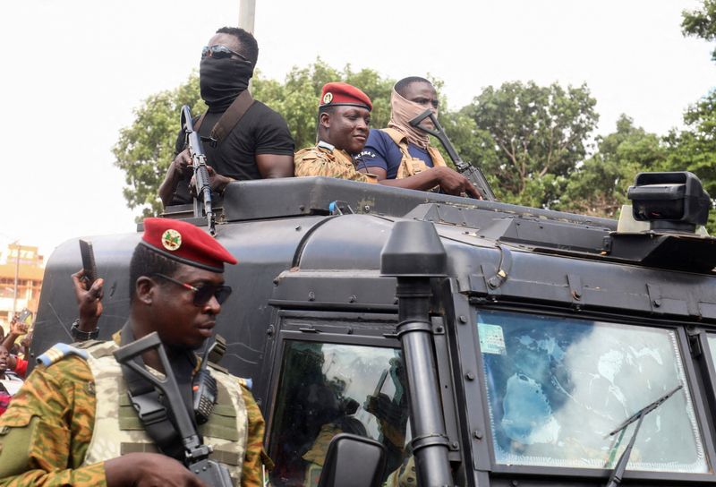 © Reuters. FILE PHOTO: Burkina Faso's self-declared new leader Ibrahim Traore arrives at the national television standing in an armoured vehicle in Ouagadougou, Burkina Faso October 2, 2022. REUTERS/Vincent Bado/File Photo