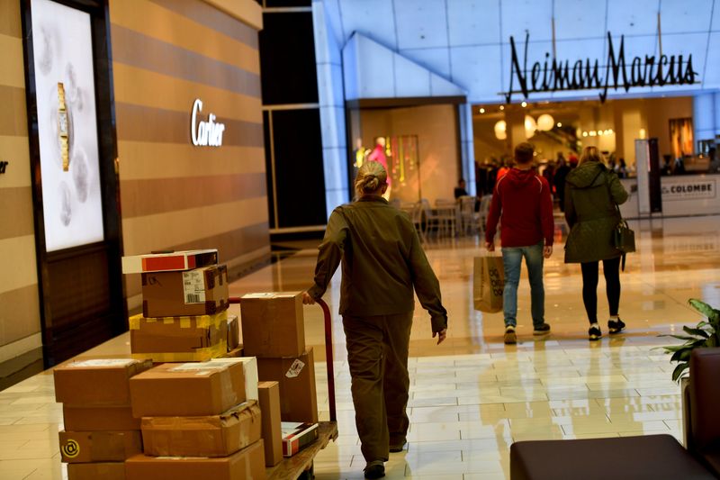 &copy; Reuters. FILE PHOTO: A delivery of boxes is wheeled as shoppers walk towards a Neiman Marcus as pre-Thanksgiving and Christmas holiday shopping accelerates at the King of Prussia Mall in King of Prussia, Pennsylvania, U.S. November 22, 2019. REUTERS/Mark Makela/Fi