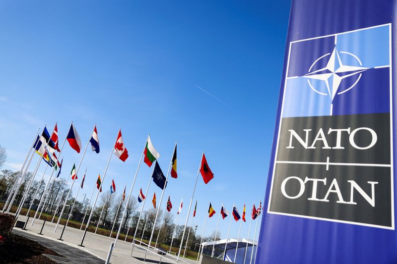 © Reuters. FILE PHOTO: Flags flutter as the NATO foreign ministers' meeting takes place at the Alliance's headquarters in Brussels, Belgium April 4, 2023. REUTERS/Johanna Geron/File Photo