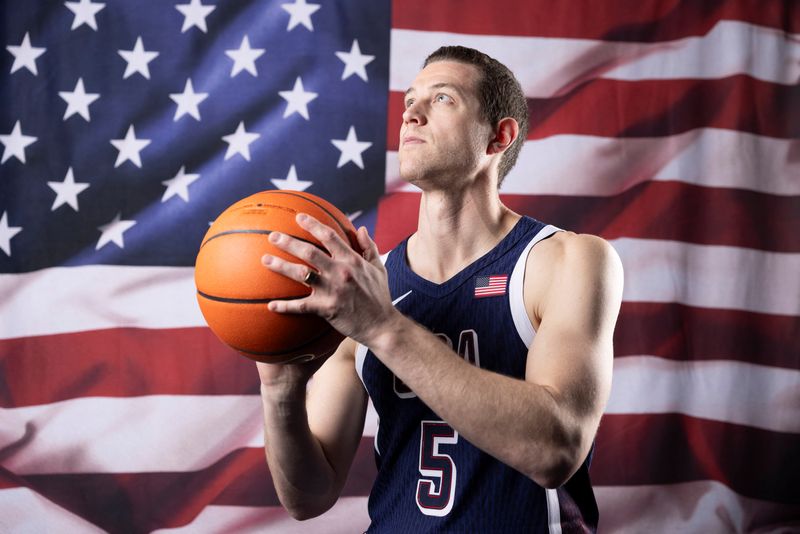 © Reuters. American men's 3x3 basketball player Jimmer Fredette poses for a portrait during the Team USA media summit ahead of the Paris Olympics and Paralympics, at an event in New York, U.S., April 17, 2024. REUTERS/Andrew Kelly