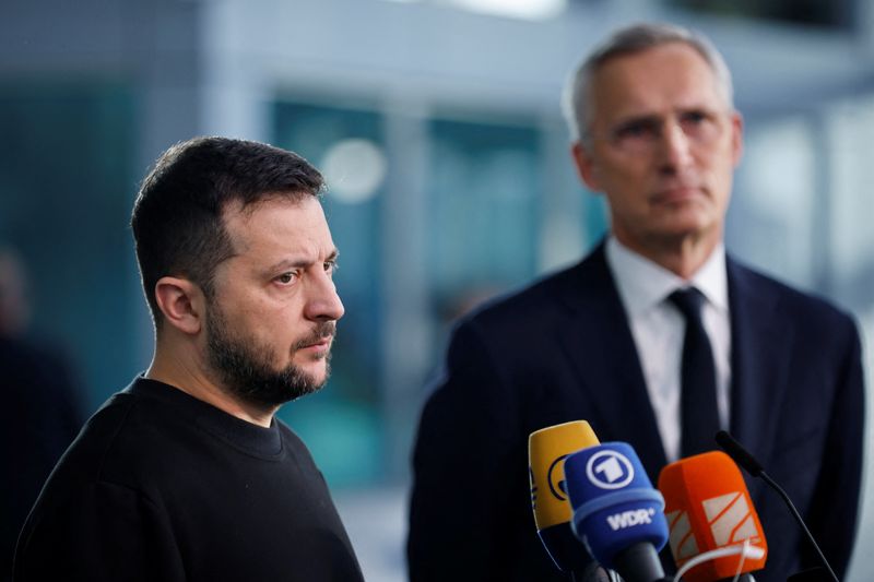 &copy; Reuters. FILE PHOTO: Ukrainian President Volodymyr Zelenskiy speaks to the media next to Secretary General of NATO Jens Stoltenberg on the day of a NATO Defence Ministers' meeting at the Alliance's headquarters in Brussels, Belgium October 11, 2023. REUTERS/Johann