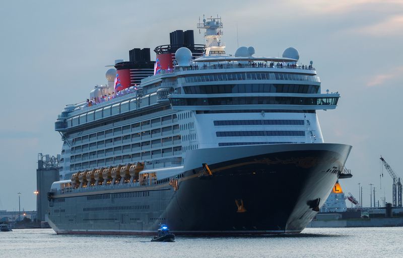 &copy; Reuters. FILE PHOTO: Disney Dream, a Disney Cruise Lines' ship, sails to the Bahamas on the first Disney cruise for paying customers since they were stopped during the coronavirus disease (COVID-19) pandemic, from Port Canaveral in Florida, U.S., August 9, 2021. R