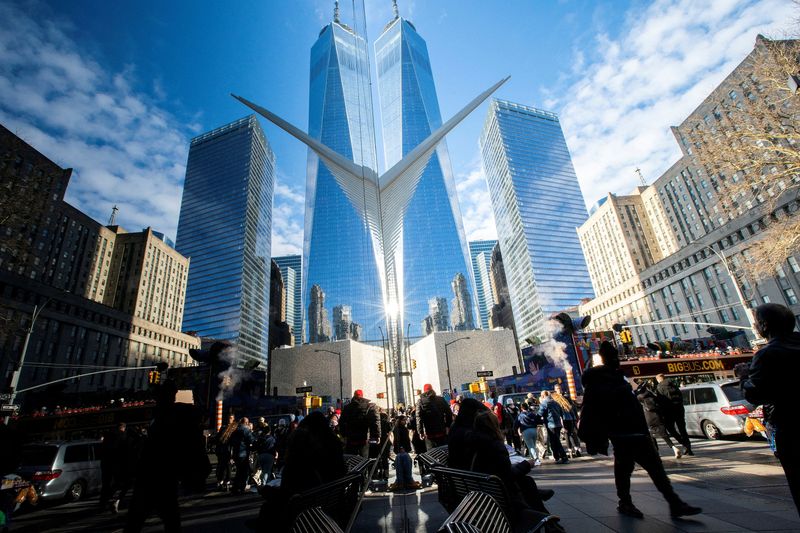 &copy; Reuters. FILE PHOTO: People walk around the Financial District near the New York Stock Exchange (NYSE) in New York, U.S., December 29, 2023. REUTERS/Eduardo Munoz/File Photo