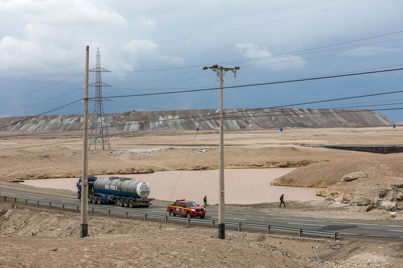 &copy; Reuters. File photo: Vehicles travel along a road, with "Chuquicamata" copper mine seen in the background, after heavy rains hit north of Chile near Calama, Chile, February 8, 2019. REUTERS/John Yevenes/File photo