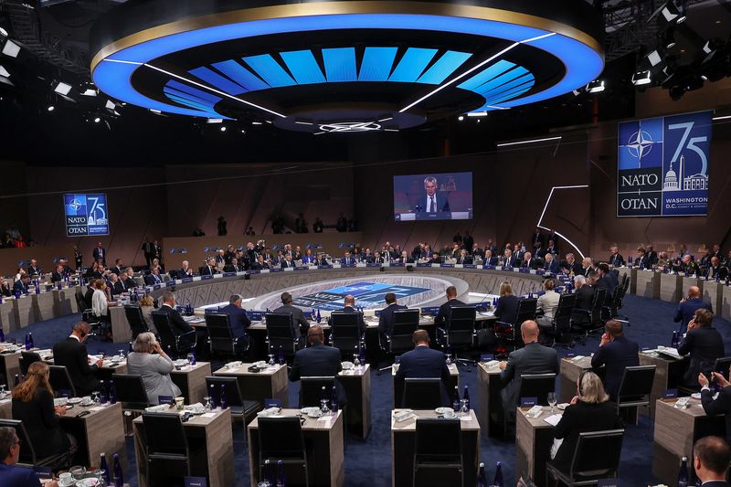 © Reuters. FILE PHOTO: World leaders attend a meeting of the NATO-Ukraine Council, during NATO's 75th anniversary summit in Washington, U.S., July 11, 2024. REUTERS/Yves Herman/File Photo