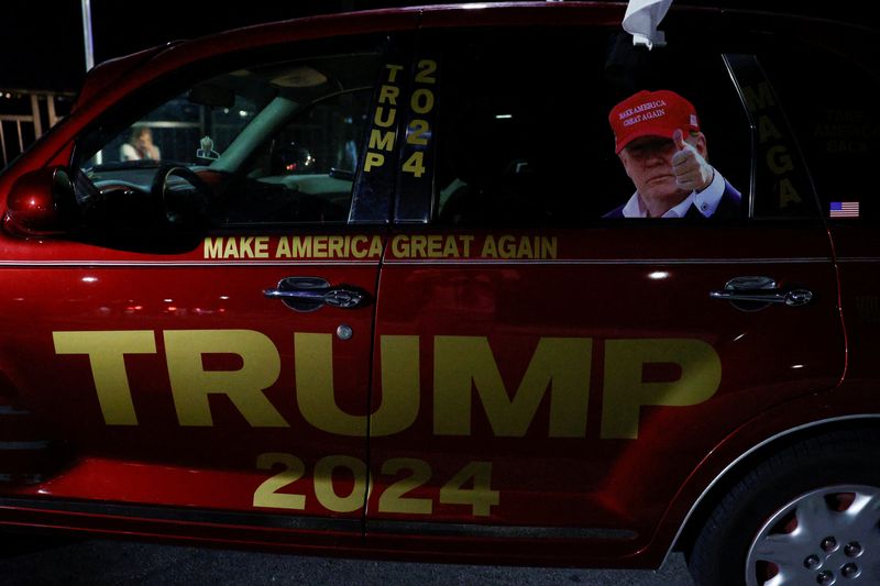 &copy; Reuters. A car with an image of Republican presidential candidate and former U.S. President Donald Trump is parked after he  was injured when shots were fired during a campaign rally held in Butler, outside Trump's Mar-a-Lago resort in Palm Beach, Florida, U.S., J