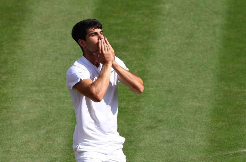 &copy; Reuters. Tennis - Wimbledon - All England Lawn Tennis and Croquet Club, London, Britain - July 14, 2024 Spain's Carlos Alcaraz celebrates winning the men's singles final against Serbia's Novak Djokovic REUTERS/Matthew Childs