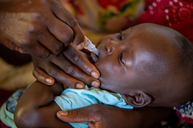 &copy; Reuters. FILE PHOTO: A child receives an oral Malaria vaccine at Chileka Health Center, in Lilongwe, Malawi in this undated handout photo. Benny Khanyizira/UNICEF/Handout via REUTERS/File Photo