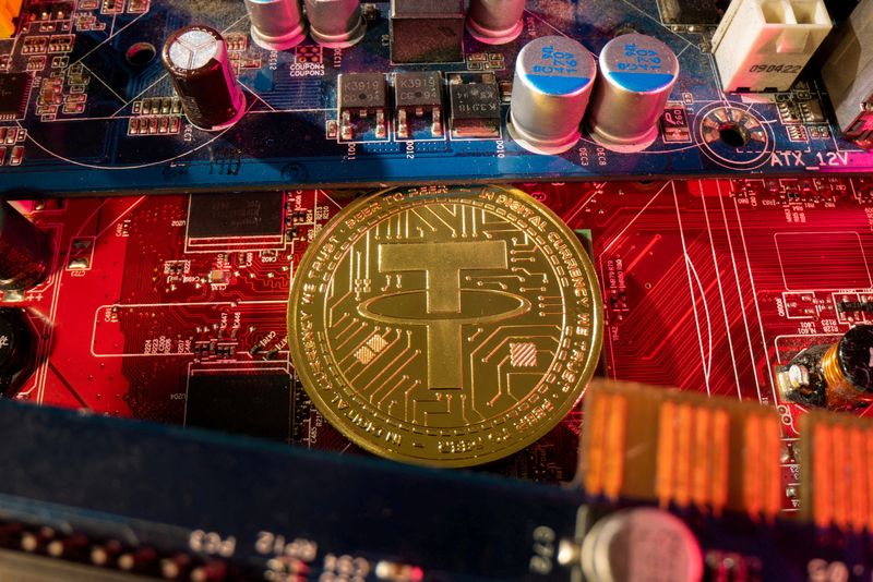 © Reuters. FILE PHOTO: A representation of cryptocurrency Tether is placed on a PC motherboard, in this illustration taken June 16, 2023. REUTERS/Dado Ruvic/Illustration/File Photo