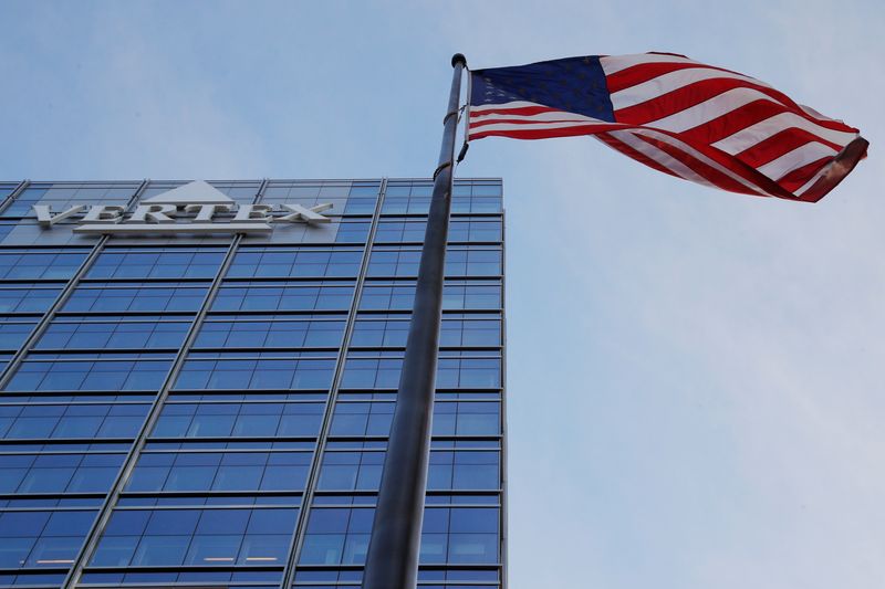 © Reuters. FILE PHOTO: A U.S. flag flies next to the headquarters of Vertex in Boston, Massachusetts, U.S., January 28, 2019.   REUTERS/Brian Snyder