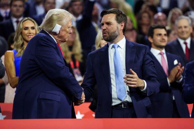 © Reuters. Republican presidential nominee and former U.S. President Donald Trump greets Republican vice presidential nominee J.D. Vance as he attends Day 1 of the Republican National Convention (RNC) at the Fiserv Forum in Milwaukee, Wisconsin, U.S., July 15, 2024. REUTERS/Andrew Kelly