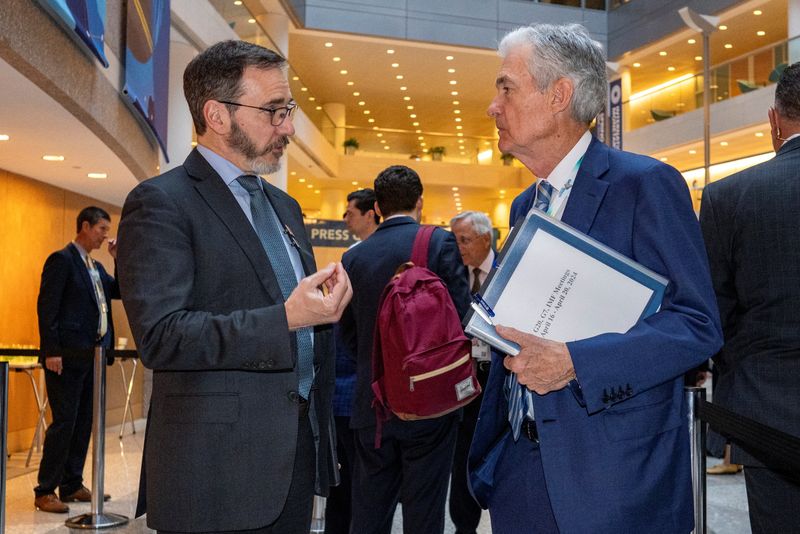 &copy; Reuters. File photo: Chief Economist, International Monetary Fund Pierre-Olivier Gourinchas, left, speaks with Federal Reserve Chair Jerome Powell prior to the start of the International Monetary and Financial Committee (IMFC) plenary session at the IMF and World 