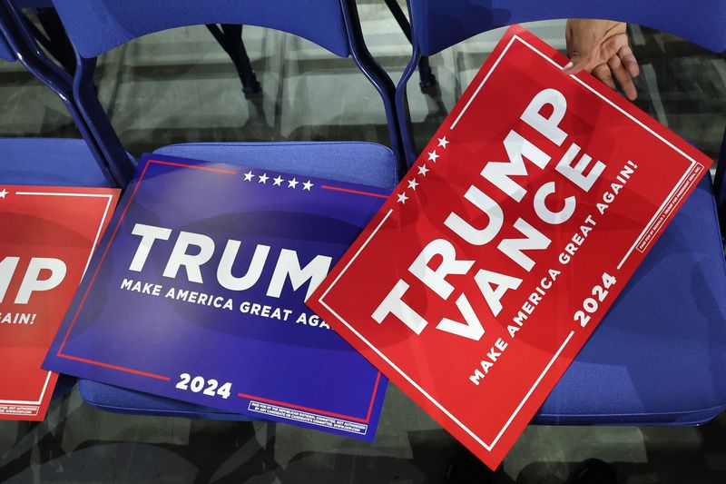 &copy; Reuters. Signs in support of Republican presidential nominee and former U.S. President Donald Trump and Republican vice presidential nominee J.D. Vance on seats ahead of Day 2 of the Republican National Convention (RNC), at the Fiserv Forum in Milwaukee, Wisconsin