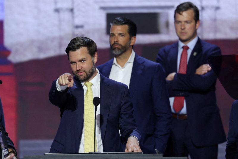 &copy; Reuters. Republican vice presidential nominee J.D. Vance gestures as he is joined onstage by Donald Trump Jr. during his walk-thru ahead of Day 2 of the Republican National Convention (RNC), at the Fiserv Forum in Milwaukee, Wisconsin, U.S., July 16, 2024. REUTERS