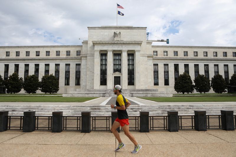 &copy; Reuters. FILE PHOTO: A jogger runs past the Federal Reserve building in Washington, DC, U.S., August 22, 2018. REUTERS/Chris Wattie/File Photo