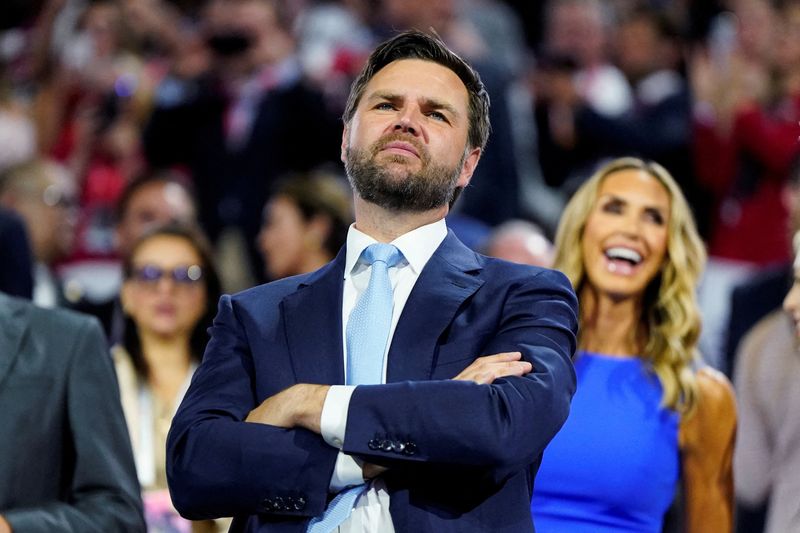 &copy; Reuters. FILE PHOTO: Republican vice presidential nominee J.D. Vance, with RNC co-chair Lara Trump behind him, looks at the stage during Day 1 of the Republican National Convention (RNC), at the Fiserv Forum in Milwaukee, Wisconsin, U.S., July 15, 2024. REUTERS/El