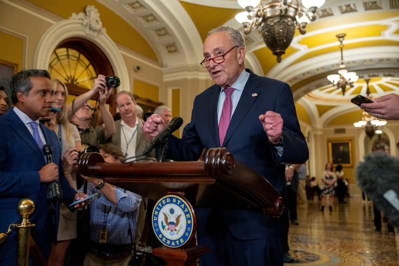 © Reuters. FILE PHOTO: Senate Majority Leader Chuck Schumer (D-NY) answers reporters questions during a press conference following the weekly Senate caucus luncheons on Capitol Hill in Washington, U.S. July 9, 2024. REUTERS/Ken Cedeno/File Photo