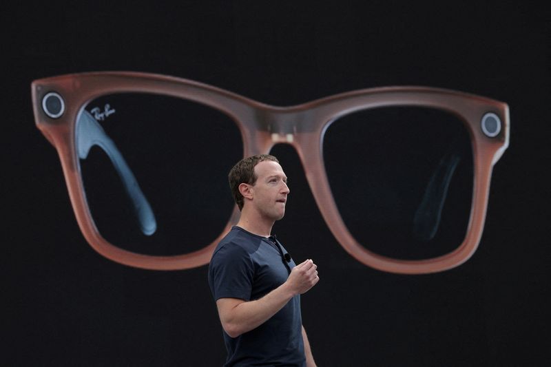 &copy; Reuters. FILE PHOTO: Meta CEO Mark Zuckerberg delivers a speech, as a pair of Ray-Ban smart glasses appear on screen, during the Meta Connect event at the company's headquarters in Menlo Park, California, U.S., September 27, 2023. REUTERS/Carlos Barria/File Photo