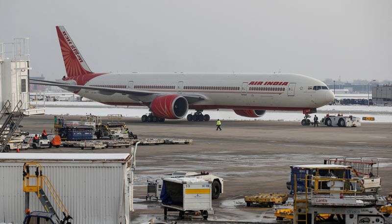 © Reuters. FILE PHOTO: An Air India Boeing 777-300ER plane is towed at O'Hare International Airport in Chicago, Illinois, U.S. November 30, 2018. REUTERS/Kamil Krzaczynski/File Photo