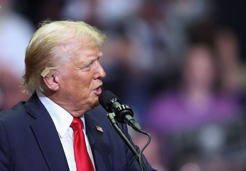 &copy; Reuters. Republican presidential nominee and former U.S. President Donald Trump wears a flesh-colored bandage on his ear as he holds a campaign rally for the first time with his running mate, Republican vice presidential nominee U.S. Senator J.D. Vance (R-OH) in G