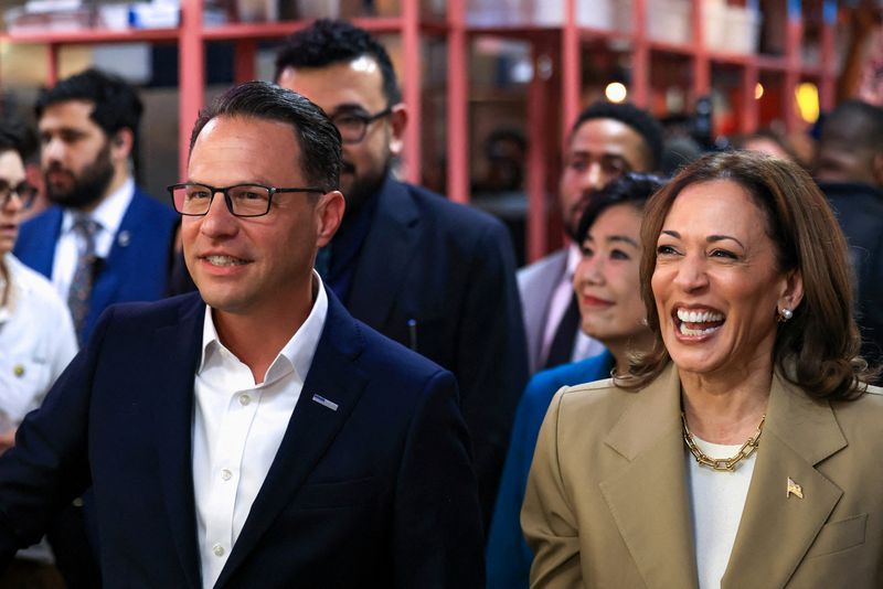 &copy; Reuters. FILE PHOTO: U.S. Vice President Kamala Harris and Pennsylvania Governor Josh Shapiro react during a visit to the Reading Terminal Market in Philadelphia, Pennsylvania, U.S., July 13, 2024. REUTERS/Kevin Mohatt/File Photo