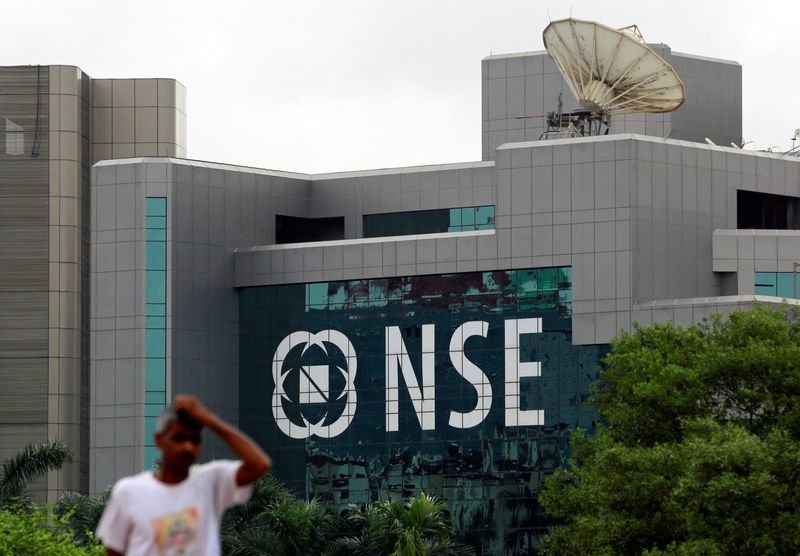 &copy; Reuters. FILE PHOTO; A man walks past the NSE (National Stock Exchange) building in Mumbai, India July 11, 2017. REUTERS/Danish Siddiqui/File Photo