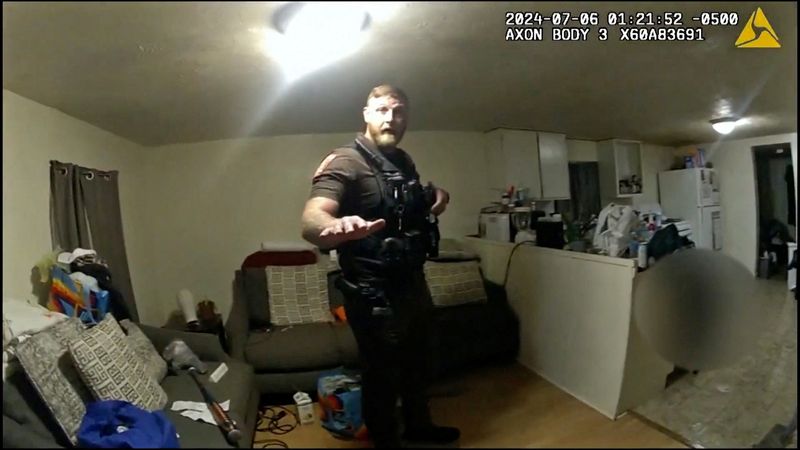 © Reuters. Sangamon County Sheriff's Deputy Sean Grayson speaks with his partner after shooting Sonya Massey, during a call for help at her home July 6 captured on a still photograph from body camera video released by the Illinois State Police July 22, 2024.   Illinois State Police/Handout via REUTERS