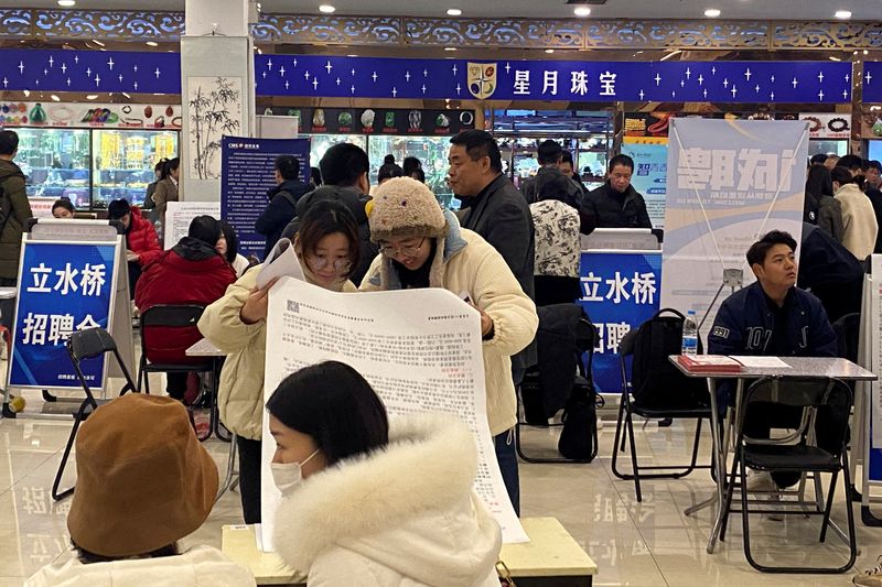 &copy; Reuters. FILE PHOTO: People attend a job fair following the Lunar New Year holiday, in Beijing, China, February 23, 2024. REUTERS/Ellen Zhang/File Photo