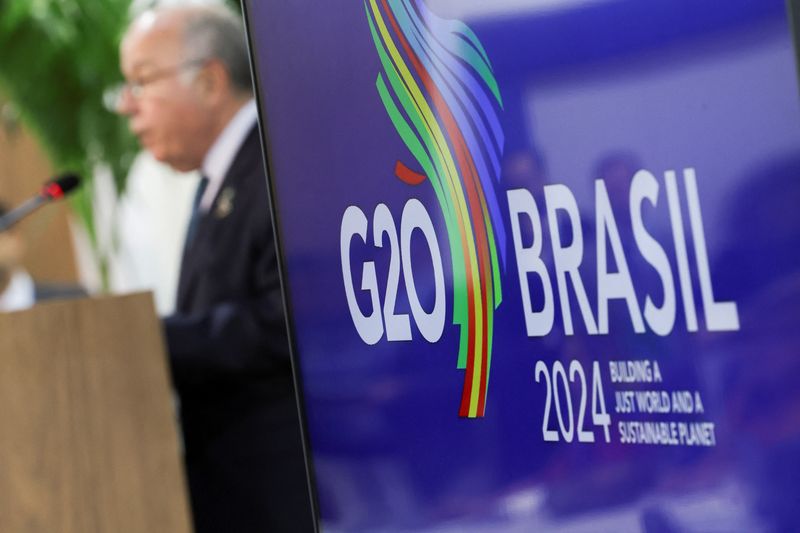 &copy; Reuters. FILE PHOTO: A logo of G20 is displayed as Brazilian Foreign Minister Mauro Vieira speaks during a press conference following the G20 Foreign Ministers' Meeting, in Rio de Janeiro, Brazil February 22, 2024. REUTERS/Ricardo Moraes/File Photo