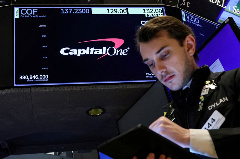 &copy; Reuters. FILE PHOTO: A screen displays the logo and trading information for Capital One Financial as a trader works on the floor at the New York Stock Exchange in New York City, U.S., February 20, 2024.  REUTERS/Brendan McDermid/File Photo