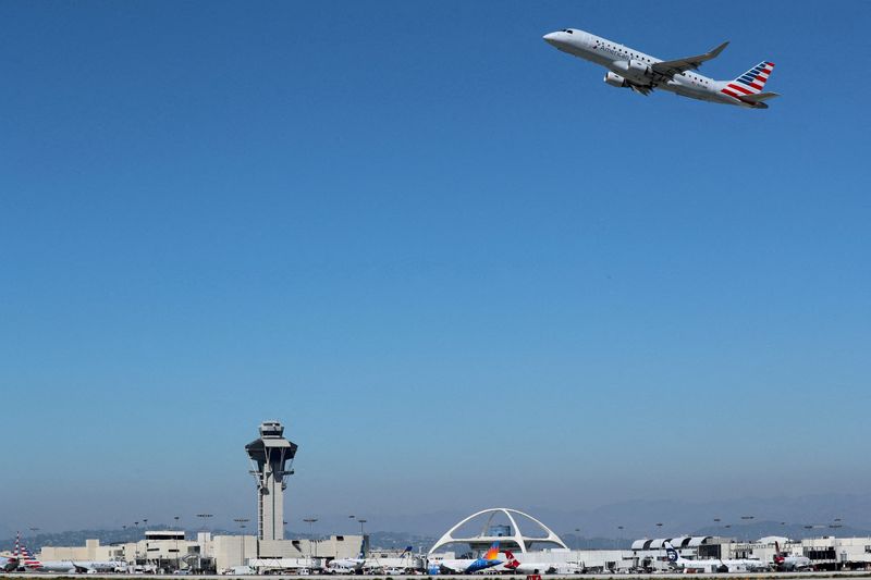 &copy; Reuters. FILE PHOTO: An American Airlines Embraer ERJ-175LR plane takes off from Los Angeles International airport (LAX) in Los Angeles, California, U.S. March 28, 2018. REUTERS/Mike Blake/File Photo